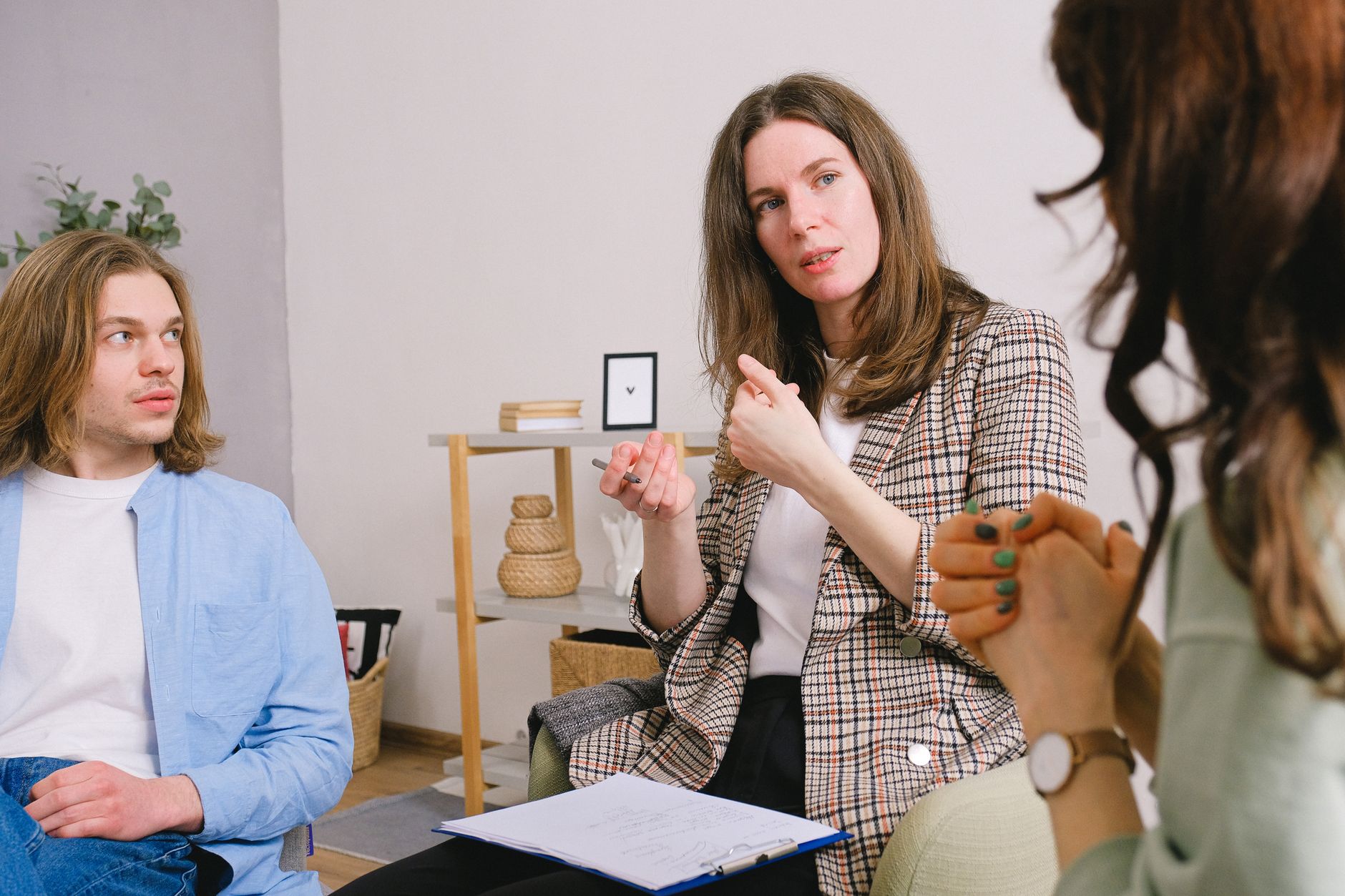 A patient coordinator engaging with a couple in a supportive consultation about treatment options.