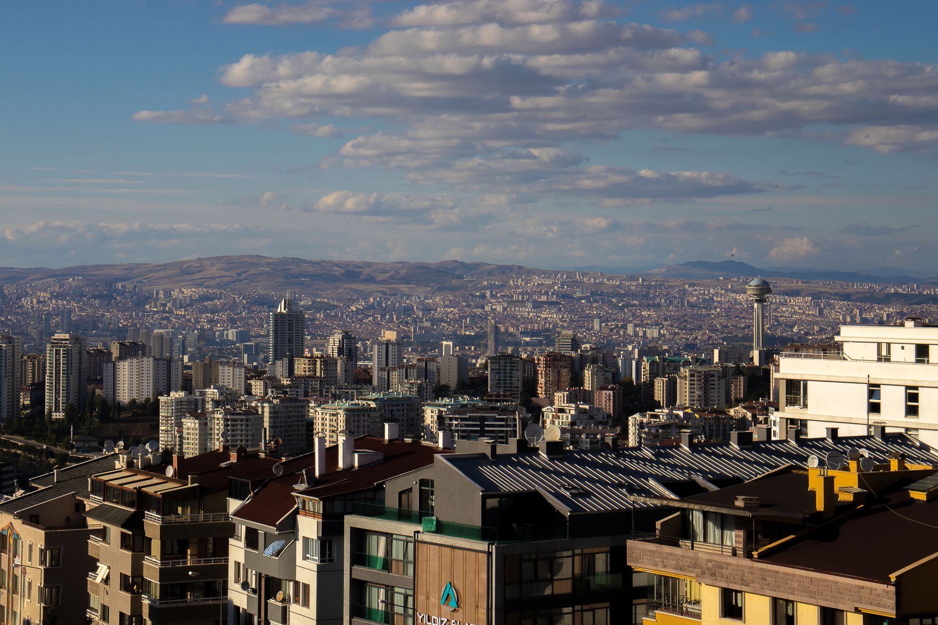 A panoramic view of Ankara, highlighting modern buildings and the city's skyline.