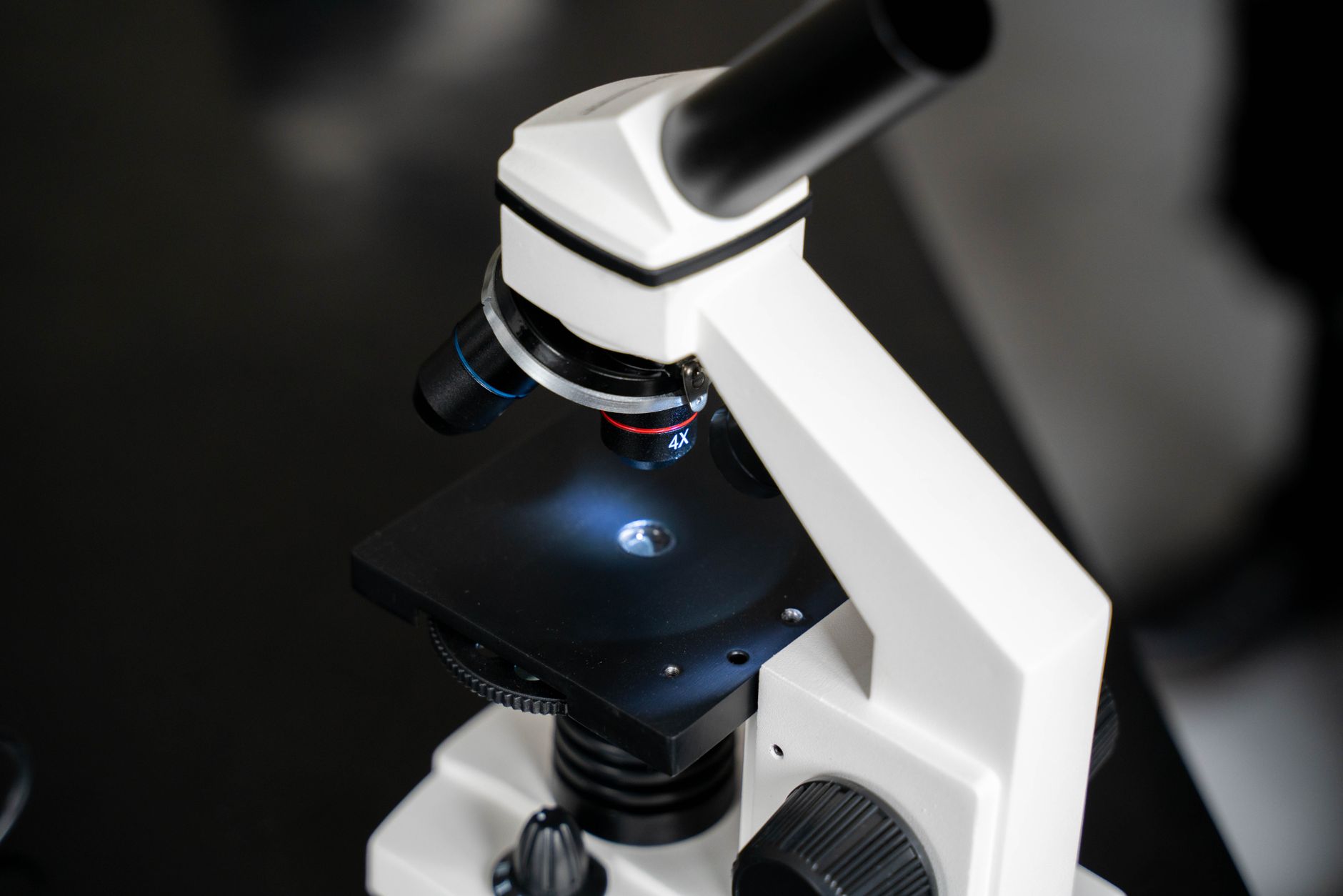 Close-up of a microscope on a lab table, used for examining embryos in an IVF laboratory.