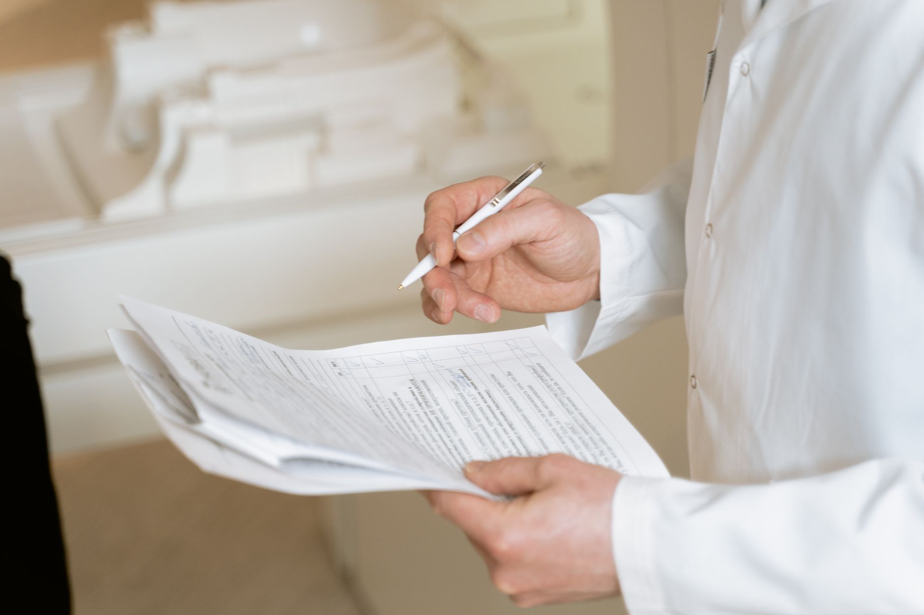 Close-up of a healthcare professional with documents, symbolizing transparency in treatment pricing.