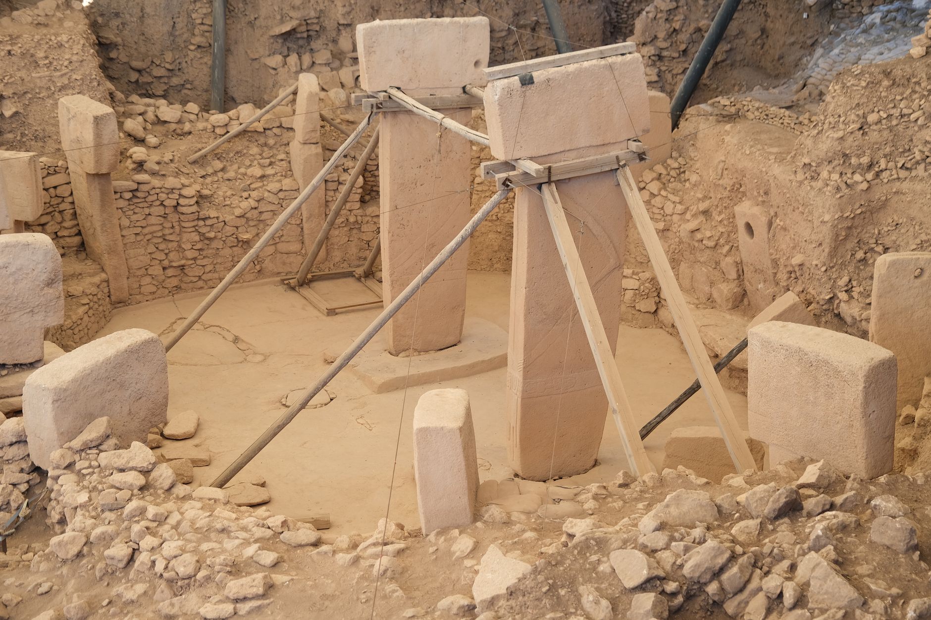 Excavated stone pillars and supports at Gobekli Tepe site in Turkey.