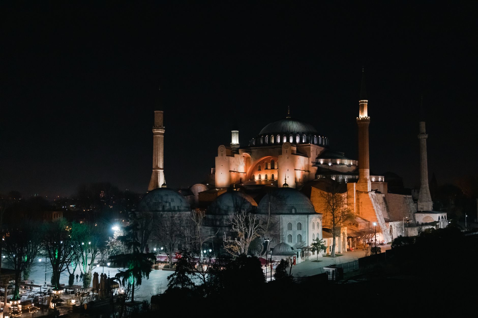Hagia Sophia's majestic dome and minarets glow beautifully at night in Istanbul.