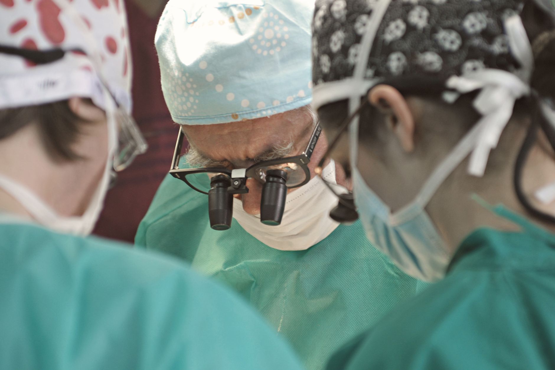 Surgeons collaborating in a high-tech operating room for gene therapy.