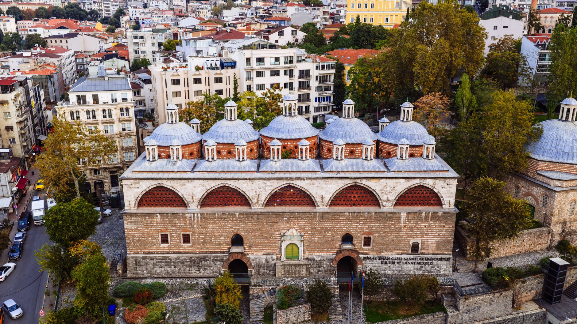 Exterior view of the restored Kılıç Ali Paşa Hamamı, showcasing its unique domed architecture in Istanbul.
