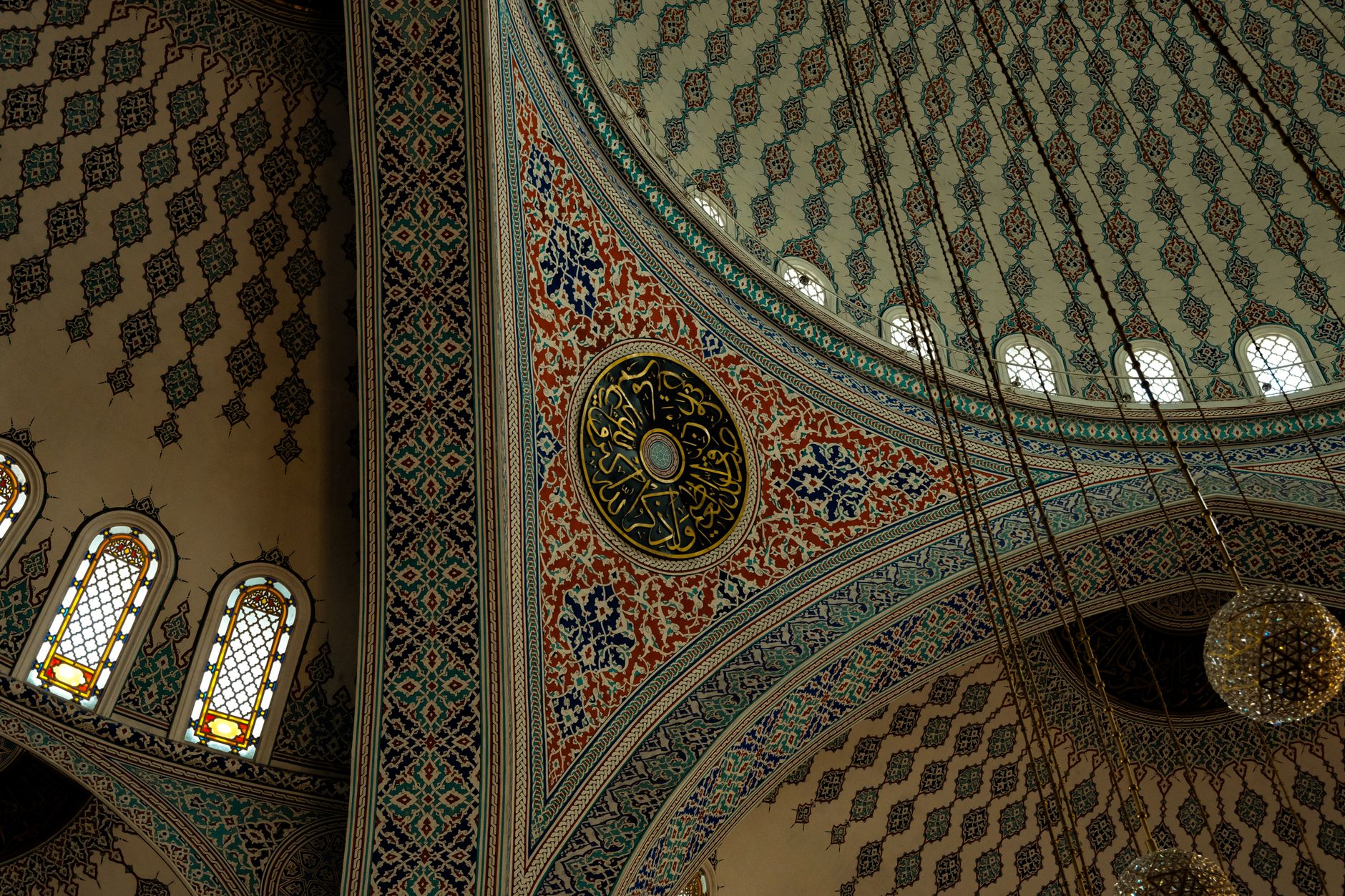 Close-up of a beautifully detailed mosaic in a mosque, showcasing vibrant colors and intricate patterns.