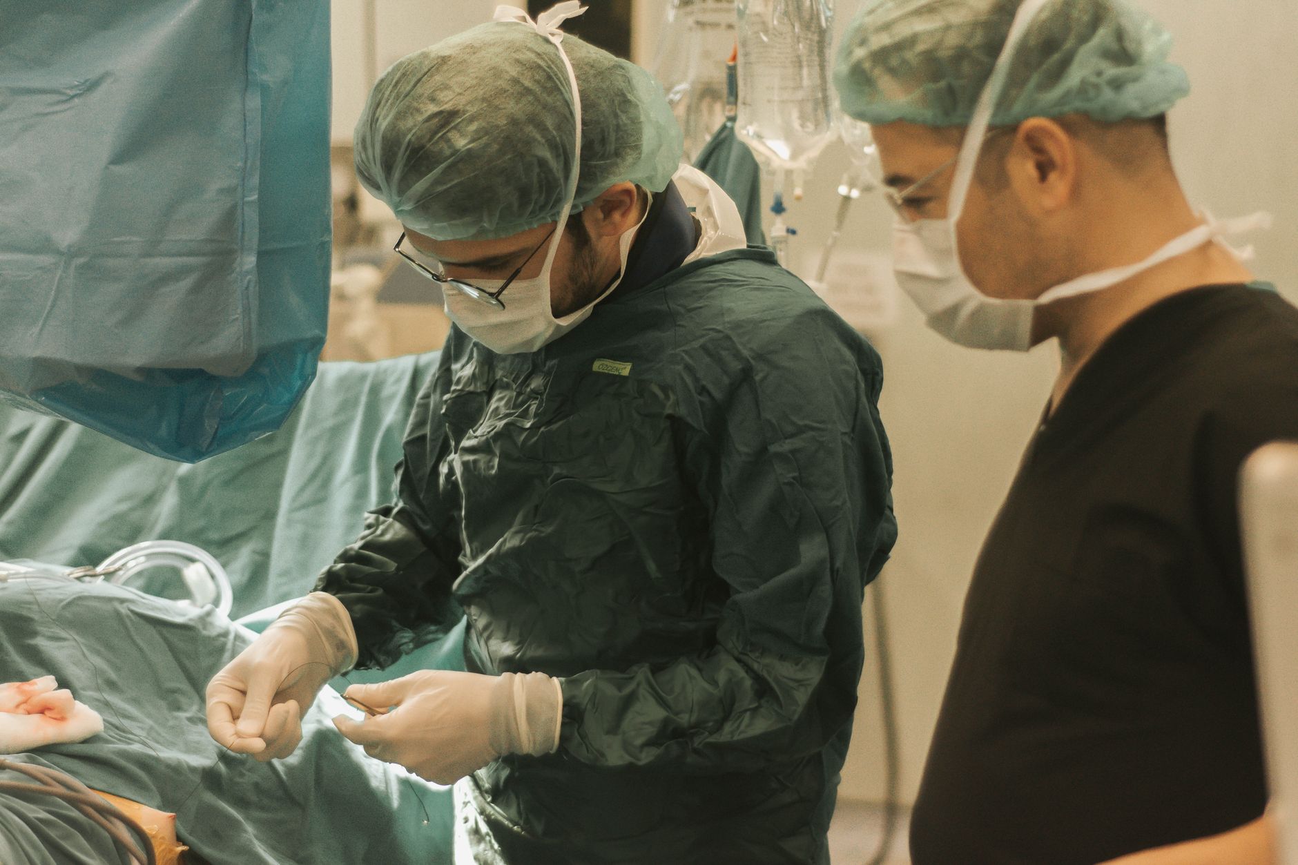 Diverse medical team in a Turkish hospital calmly working together during a surgical procedure.