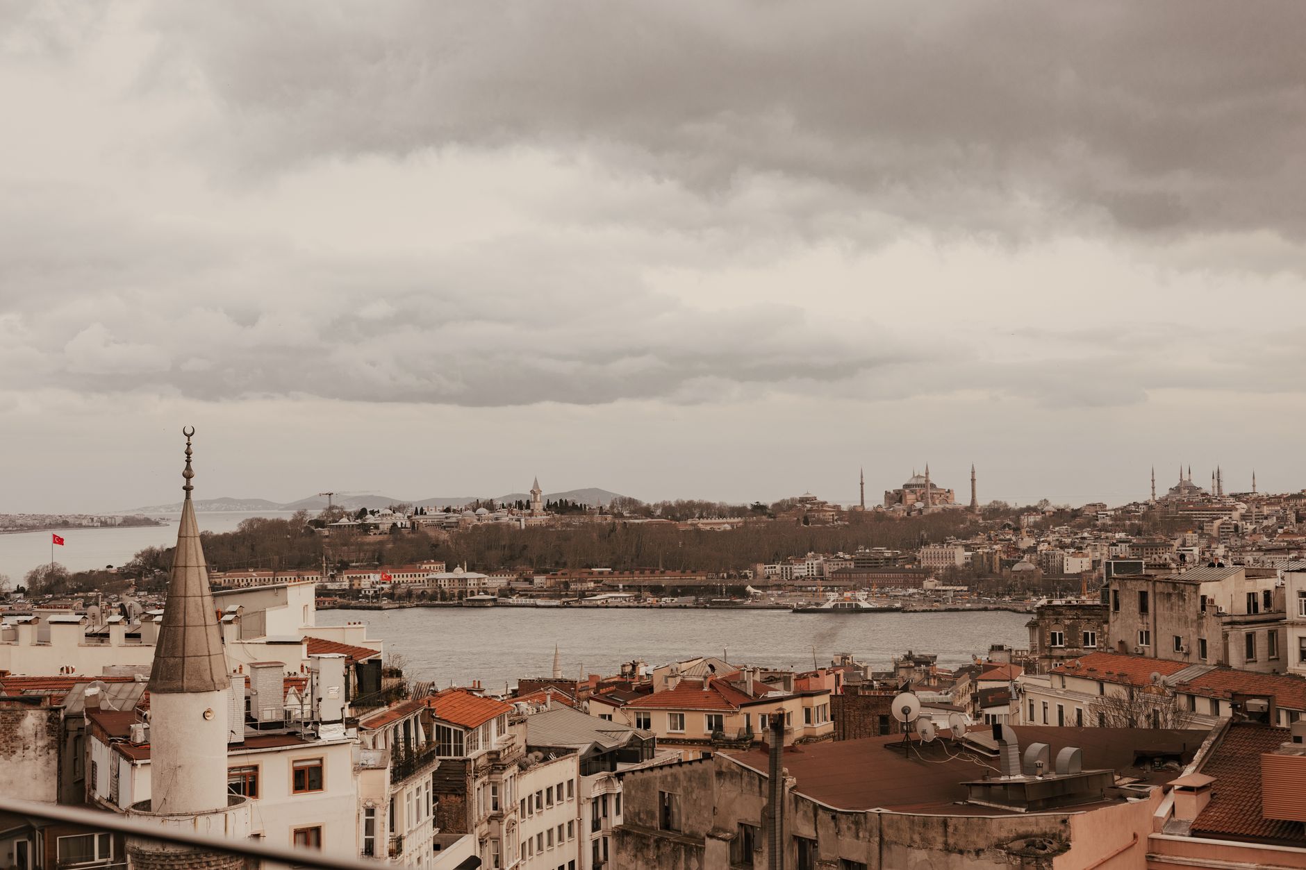 Panoramic view from a rooftop terrace showcasing Hagia Sophia and the Blue Mosque in Istanbul.