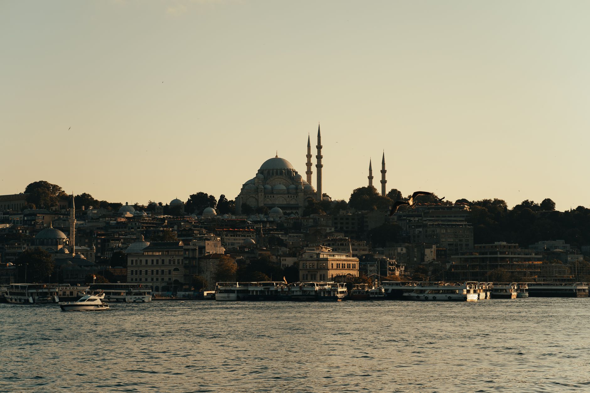 Beautiful sunset over the Bosphorus in Istanbul, featuring the Ortaköy Mosque and cityscape.