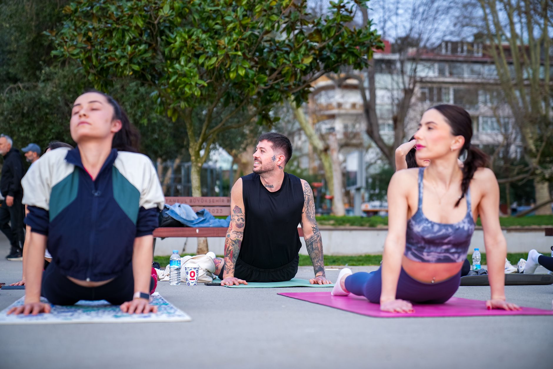 Participants engaging in a yoga session outdoors at a Turkish resort.