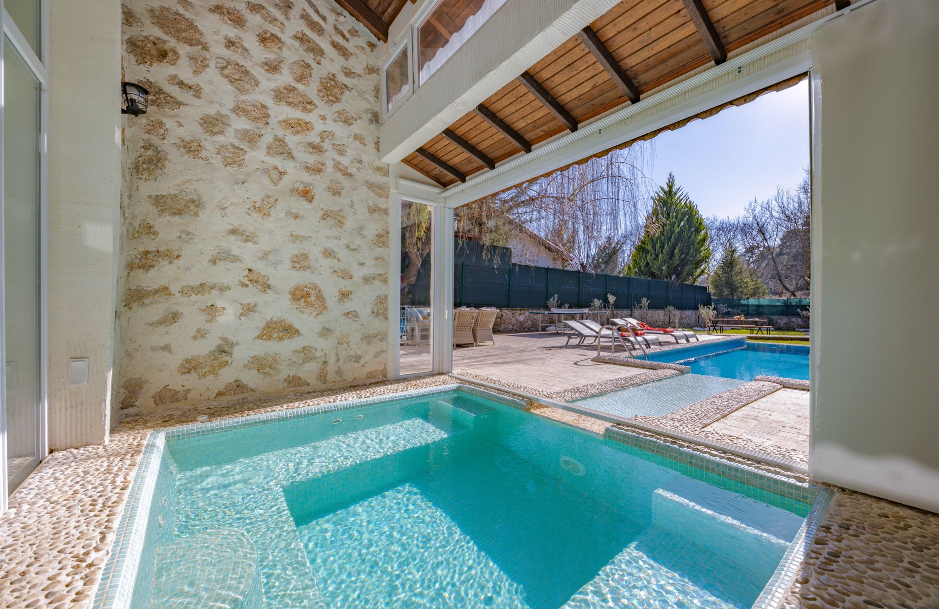 Interior view of a thermal pool with stone walls in a Bursa resort.