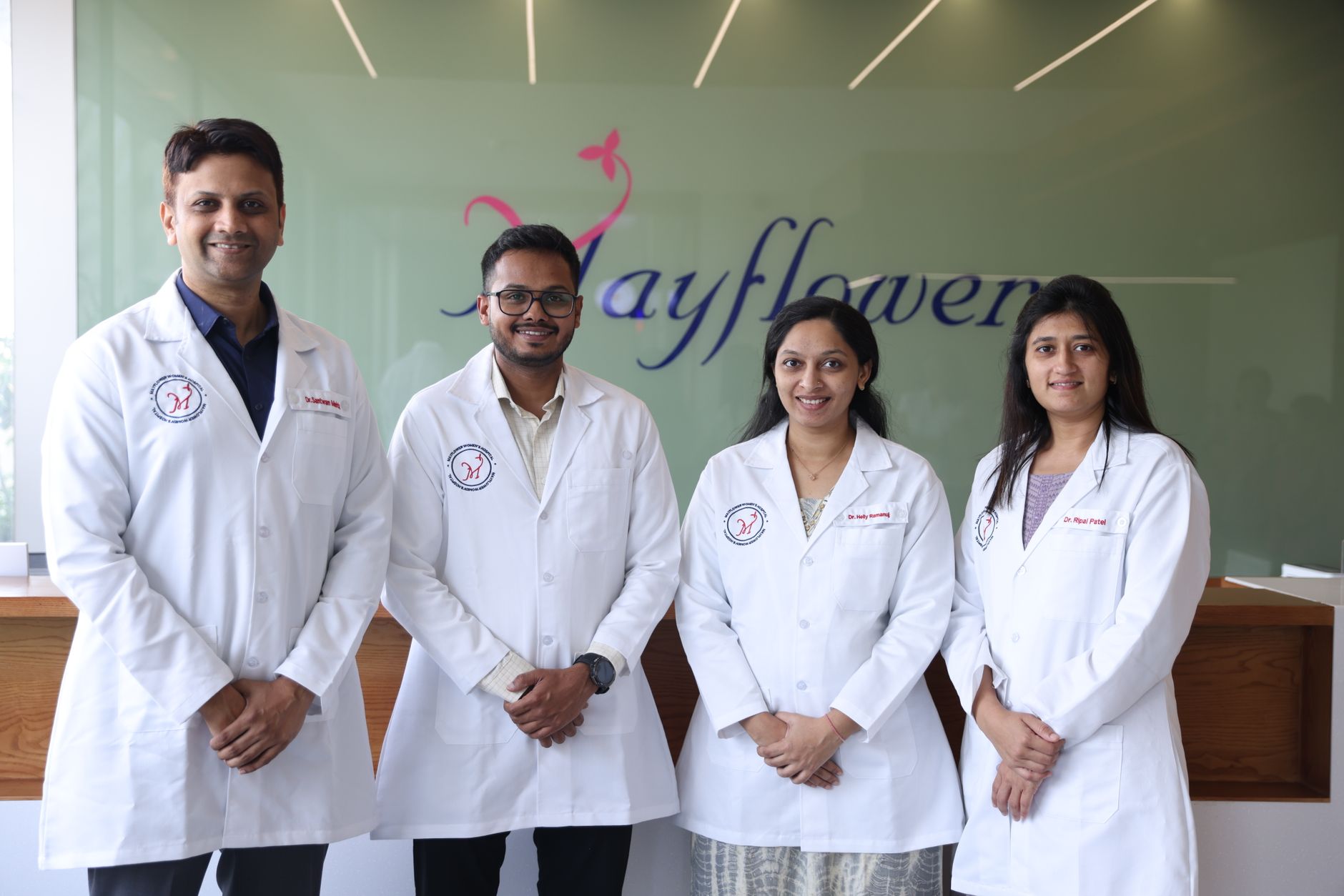 Four IVF specialists in white coats at Mayflower Clinic, Türkiye.