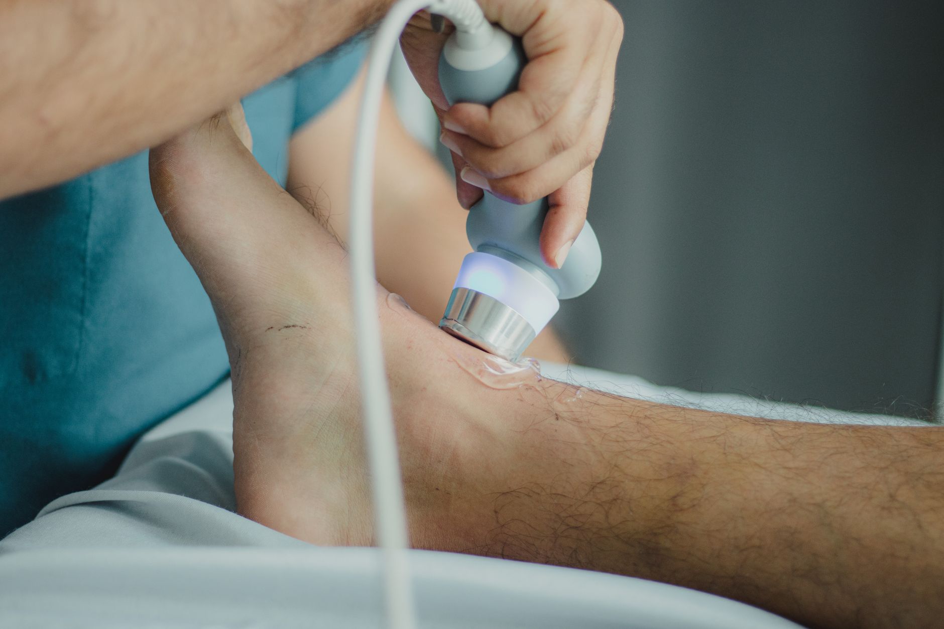 Sonographer conducting a duplex ultrasound on a patient's leg veins.