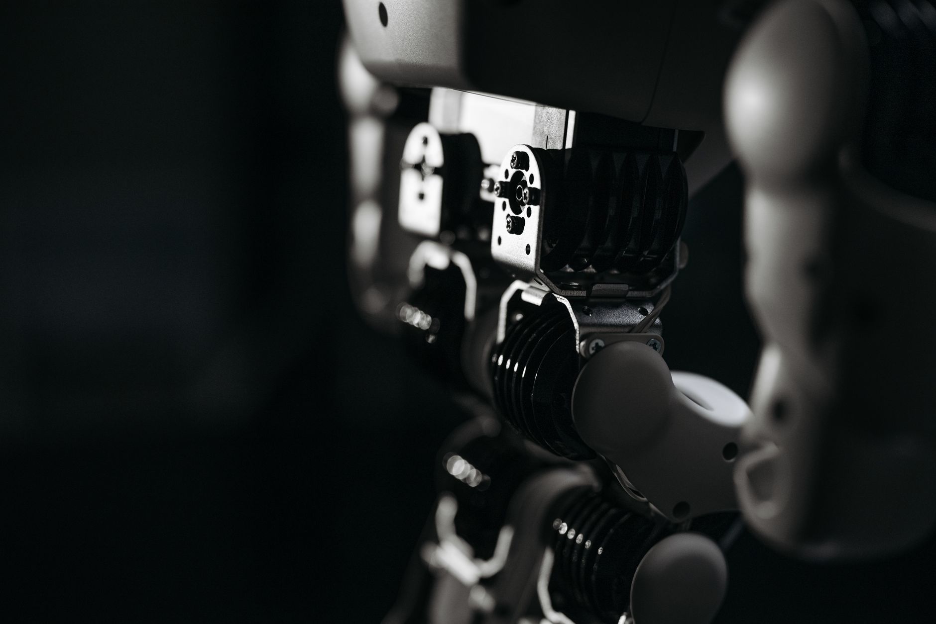 Close-up of a robotic exoskeleton used for walking therapy in a healthcare environment.
