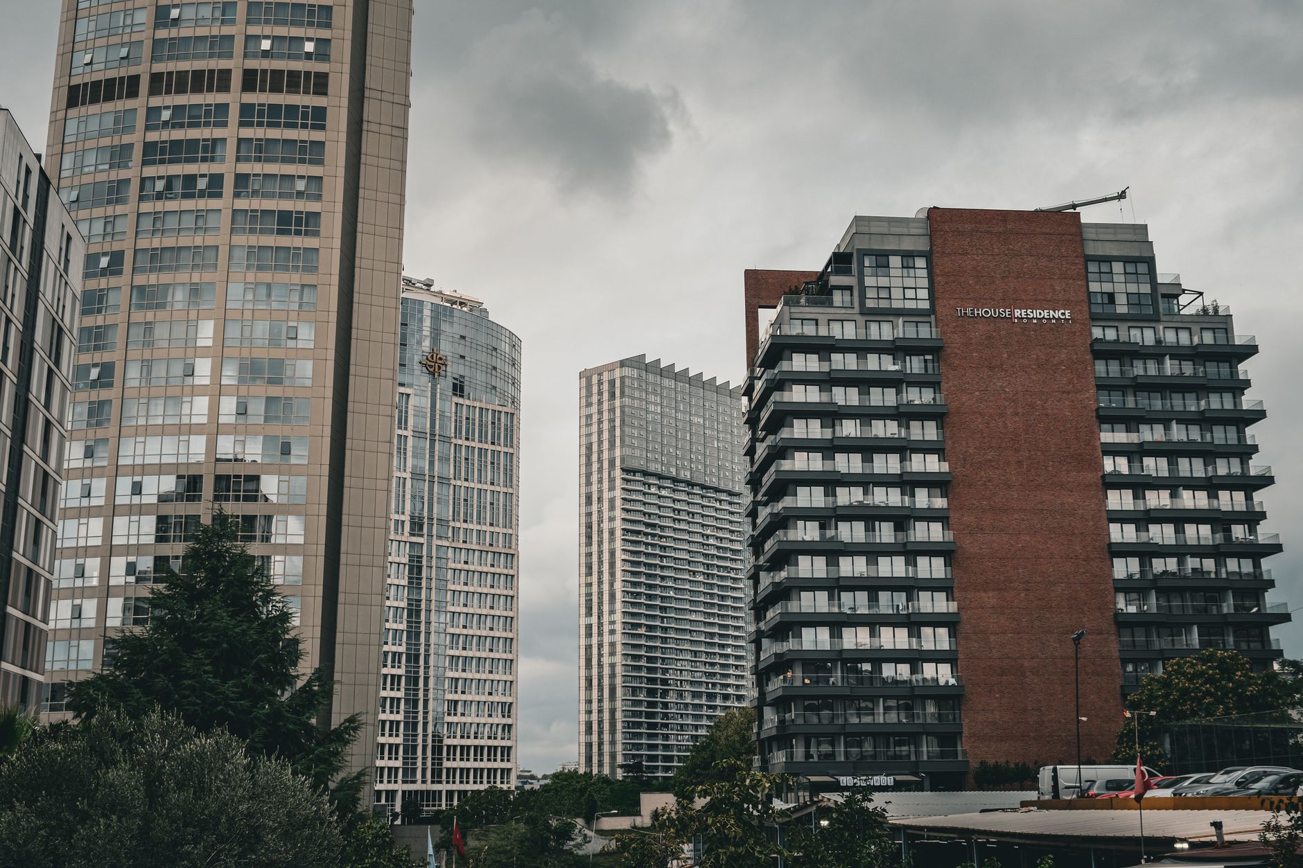 Contemporary buildings showcasing sleek designs in a bustling cityscape.